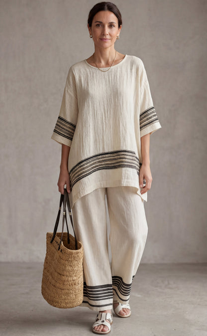 Mariella — Top elegante de lino con rayas negras y pantalones fluidos